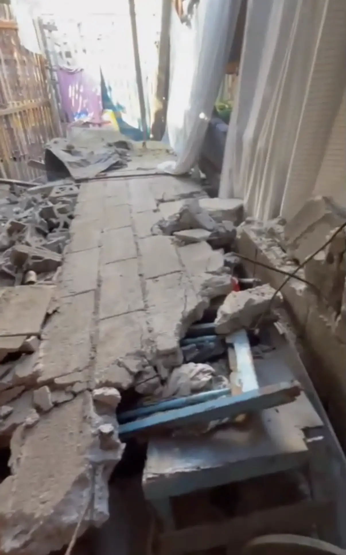 A house brought down by the earthquake, roof and walls collapsed into rubble.